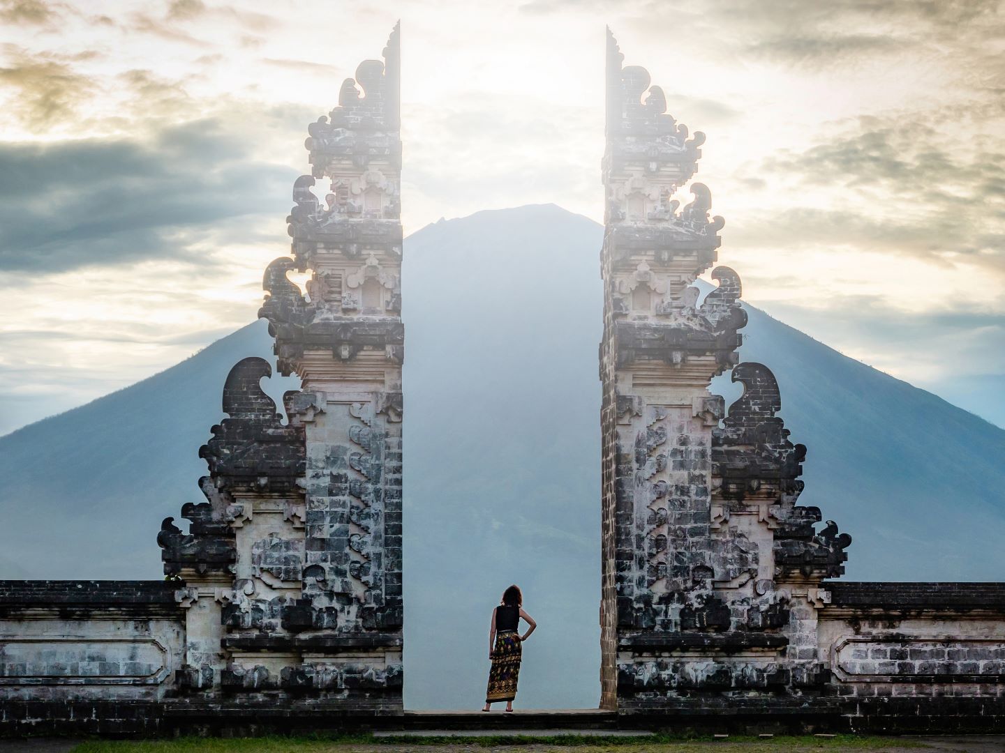 Bali, Indonesia, Traveler Standing at the Ancient Gates of Pura Lempuyang Temple aka Gates of Heaven